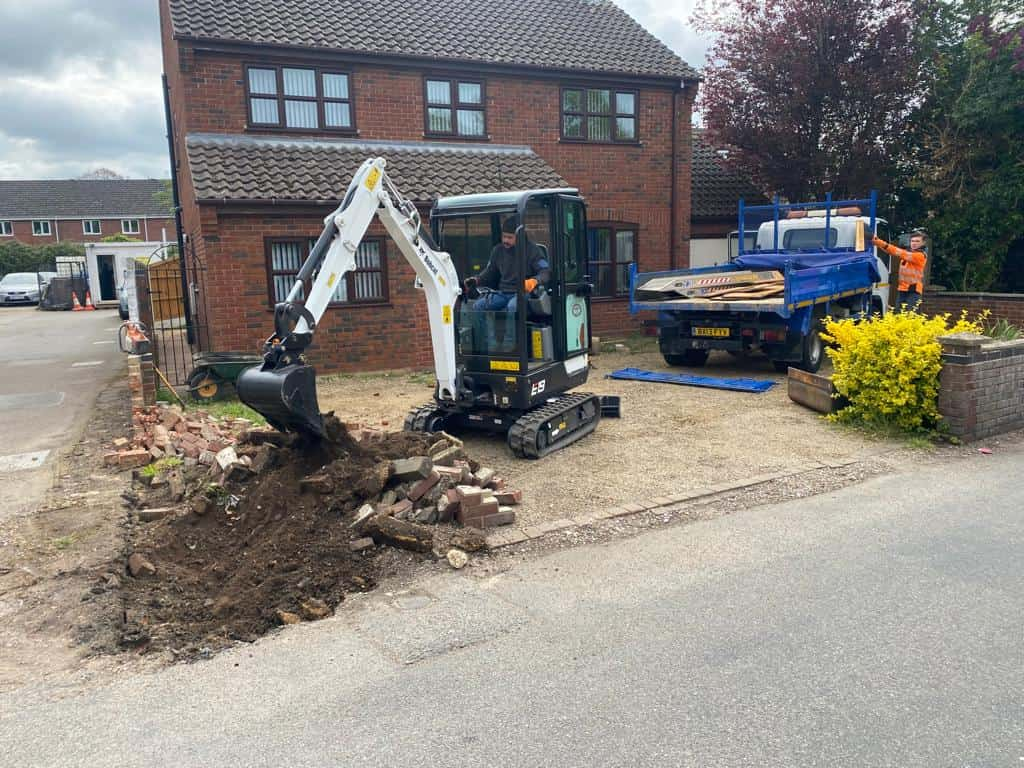 This is a photo of an operative of Towcester Driveways Digging out for a new tarmac driveway