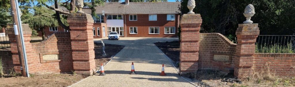 This is a photo of a newly installed chip and tar driveway, installed by Towcester Driveways